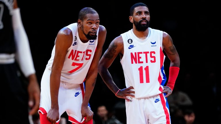 Brooklyn Nets' Kevin Durant (7) talks to Kyrie Irving (11) during the second half of an NBA basketball game. (Frank Franklin II/AP)