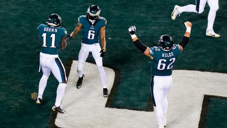 Philadelphia Eagles wide receiver DeVonta Smith (6) celebrates his touchdown catch with wide receiver A.J. Brown (11) and center Jason Kelce (62) during the first half of an NFL divisional round playoff football game against the New York Giants, Saturday, Jan. 21, 2023, in Philadelphia. (Chris Szagola/AP)