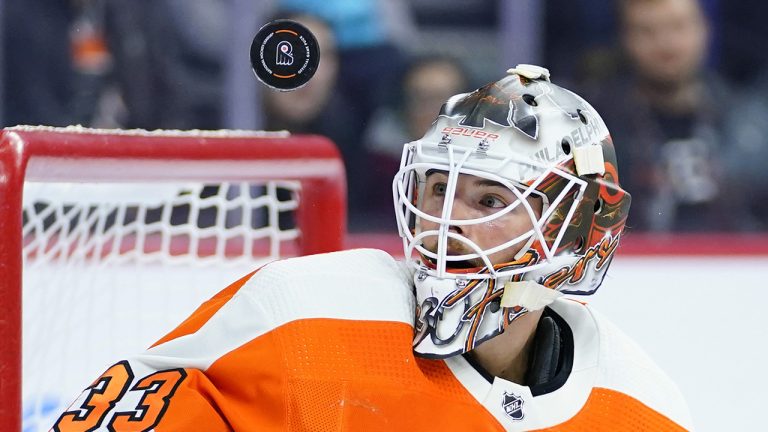 Philadelphia Flyers goaltender Samuel Ersson watches the puck after blocking a shot by the New York Islanders during the first period of a preseason NHL hockey game, Tuesday, Oct. 4, 2022, in Philadelphia. (Matt Slocum/AP)