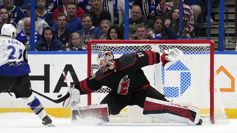 Carolina Hurricanes goaltender Frederik Andersen (31) stops a shot by Tampa Bay Lightning centre Brayden Point (21) during a shootout in an NHL hockey game Thursday, Nov. 3, 2022, in Tampa, Fla. (Chris O'Meara/AP)