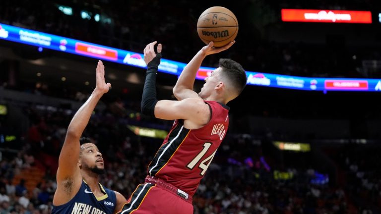 Miami Heat guard Tyler Herro goes up for a shot against New Orleans Pelicans guard CJ McCollum (3) during the first half of an NBA basketball game, Sunday, Jan. 22, 2023, in Miami. (Wilfredo Lee/AP Photo)