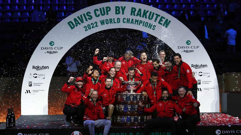 Team Canada celebrate with the trophy after winning the Davis Cup tennis final in Malaga, Spain, Sunday, Nov. 27, 2022. (Joan Monfort/AP)