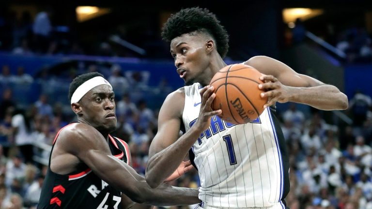 Orlando Magic's Jonathan Isaac heads to the basket against Toronto Raptors' Pascal Siakam during the second half in Game 3 of a first-round NBA basketball playoff series, Friday, April 19, 2019, in Orlando, Fla. (John Raoux/AP Photo)