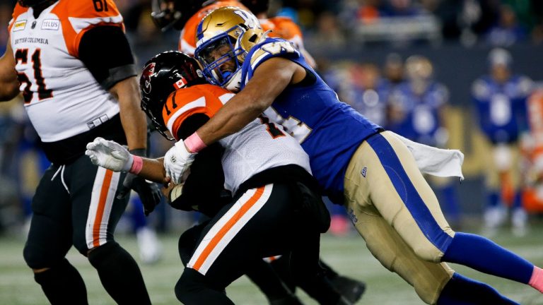 Winnipeg Blue Bombers' Jackson Jeffcoat (94) sacks B.C. Lions quarterback Antonio Pipkin (17) during second half CFL action in Winnipeg Friday, October 28, 2022. (John Woods/The Canadian Press)