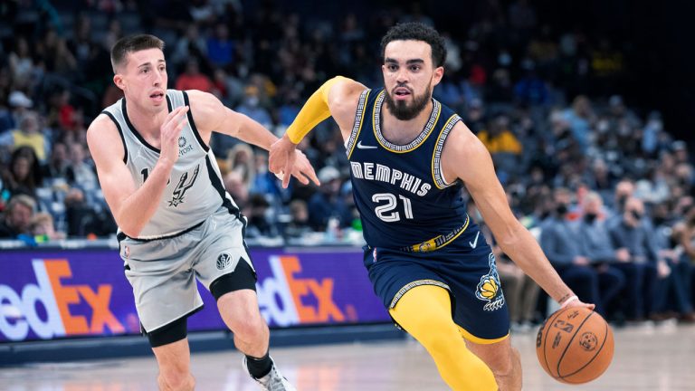 San Antonio Spurs forward Joe Wieskamp (15) defends against Memphis Grizzlies guard Tyus Jones (21) during the second half of an NBA basketball game. (Nikki Boertman/AP)