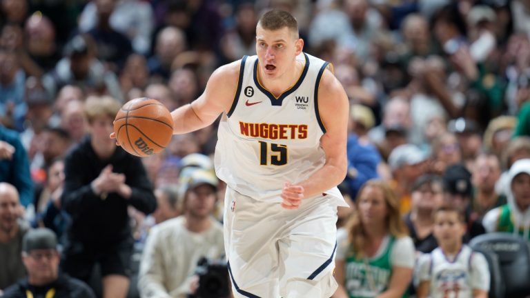 Denver Nuggets center Nikola Jokic collects a loose ball in the second half of an NBA basketball game against the Boston Celtics, Sunday, Jan. 1, 2023, in Denver. (David Zalubowski/AP)