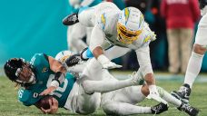 Jaguars&#8217; Lawrence makes NFL playoff history with four first-half picks