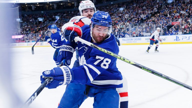 Washington Capitals left wing Marcus Johansson (90) reaches over Toronto Maple Leafs defenceman TJ Brodie (78) in the corner during the first period of their NHL hockey game against the Toronto Maple Leafs in Toronto on Sunday, Jan. 29, 2023. (Cole Burston/CP)