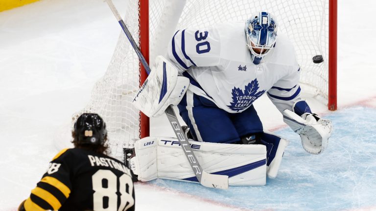 Boston Bruins' David Pastrnak (88) scores on Toronto Maple Leafs' Matt Murray (30) during the second period of an NHL hockey game Saturday, Jan. 14 2023, in Boston. (AP Photo/Michael Dwyer)