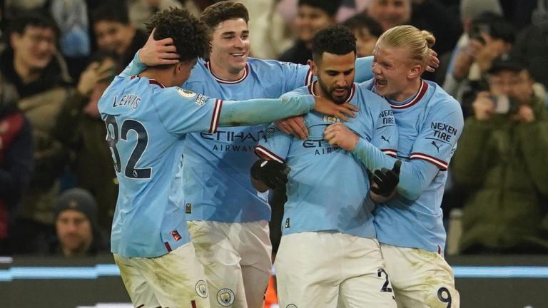 Manchester City's Riyad Mahrez, second right, celebrates with his teammates after scoring his side's third goal during the English Premier League soccer match between Manchester City and Tottenham Hotspur at the Etihad Stadium in Manchester, England, Thursday, Jan. 19, 2023. (Dave Thompson/AP)