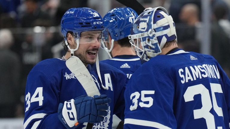 Toronto Maple Leafs centre Auston Matthews (34) and goaltender Ilya Samsonov (35) celebrate their win over the Winnipeg Jets in NHL hockey action in Toronto on Thursday Jan. 19, 2023. (Nathan Denette/CP)