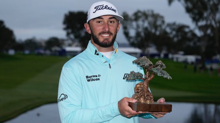 Max Homa holds the trophy after winning the Farmers Insurance Open golf tournament, Saturday, Jan. 28, 2023, in San Diego. (Gregory Bull/AP)