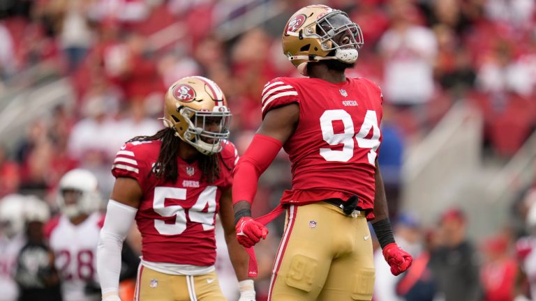 San Francisco 49ers defensive end Charles Omenihu (94) and linebacker Fred Warner (54) celebrate after defensive end Samson Ebukam sacked Arizona Cardinals quarterback David Blough during the first half of an NFL football game in Santa Clara, Calif., Sunday, Jan. 8, 2023. (Godofredo A. Vásquez/AP) 