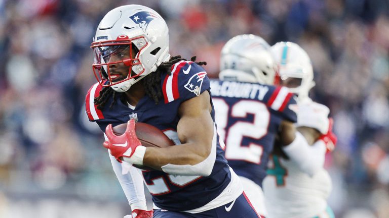 New England Patriots safety Kyle Dugger (23) heads towards the end zone, after intercepting the ball, on his touchdown run against the Miami Dolphins the during the second half of an NFL football game, Sunday, Jan. 1, 2023, in Foxborough, Mass. (Michael Dwyer/AP)