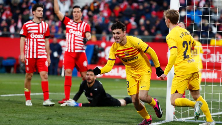 Barcelona's Pedri, centre, celebrates after scoring the opening goal during the Spanish La Liga soccer match between Girona and FC Barcelona at the Montilivi stadium in Girona, Spain, Saturday, Jan. 28, 2023. (Joan Monfort/AP)