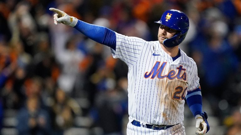 Mets star Pete Alonso appeared to escape injury after getting hit on the right hand by fastball from Dodgers pitcher James Paxton. (John Minchillo/AP)