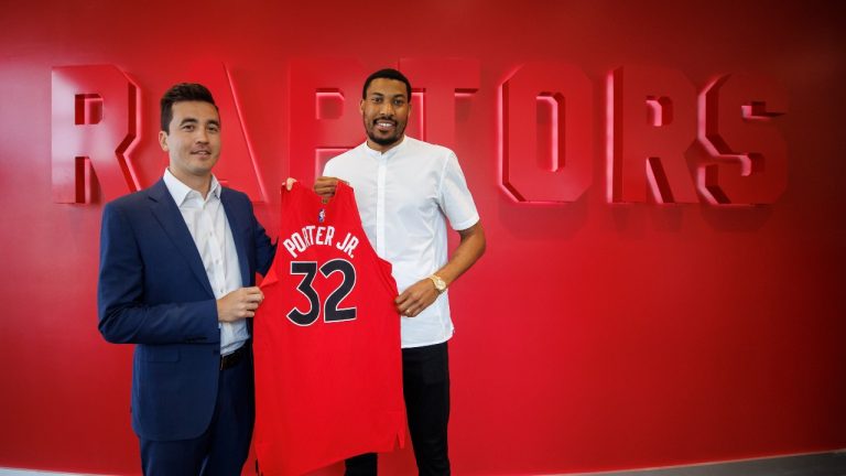 Toronto Raptors recently signed free agent Otto Porter Jr. stands alongside Raptors general manager Bobby Webster following a press conference at the Raptors practice facility in Toronto, Wed. July 6, 2022. (Cole Burston/The Canadian Press)