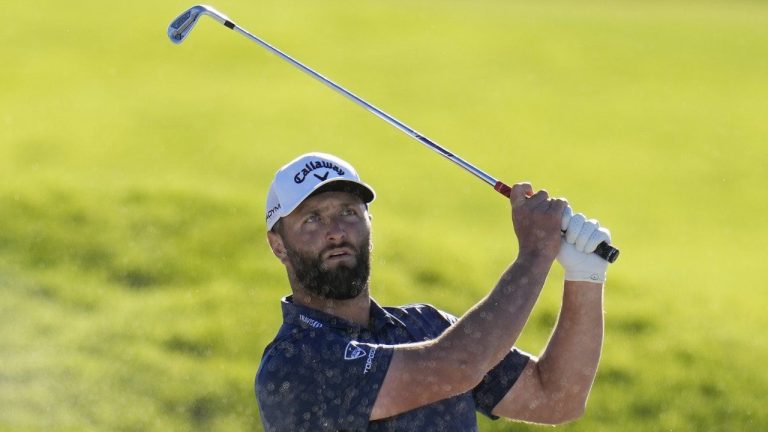 Jon Rahm, of Spain, watches after hitting out of a bunker on the 17th hole of the South Course at Torrey Pines during the third round of the Farmers Insurance Open golf tournament, Friday, Jan. 27, 2023, in San Diego. (Gregory Bull/AP)