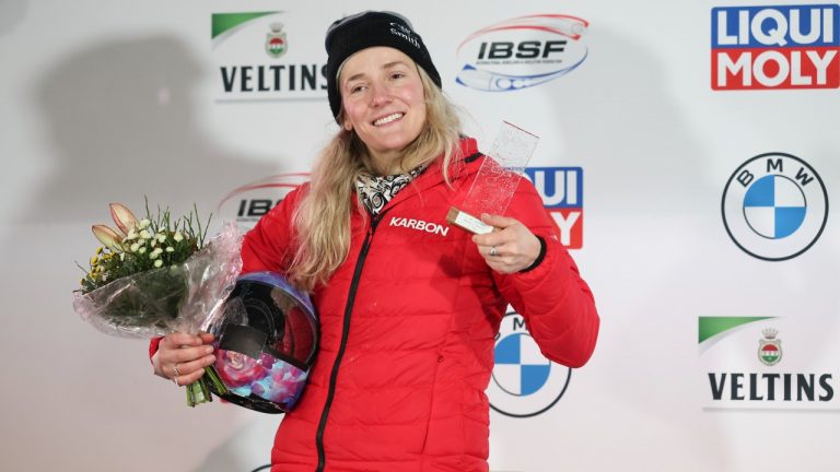 Second placed Mirela Rahneva from Canada on the podium during the award ceremony following the second run of the women's skeleton World Cup race in Winterberg, Germany, Friday, Jan. 6, 2023. (Friso Gentsch/dpa via AP)