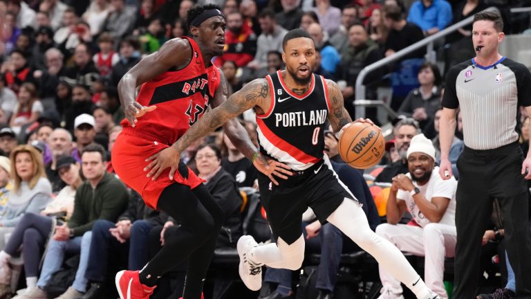 Portland Trail Blazers guard Damian Lillard (0) dribbles the ball as Toronto Raptors forward Pascal Siakam (43) defends during first half NBA basketball action in Toronto on Sunday, Jan. 8, 2023. (Frank Gunn/CP)