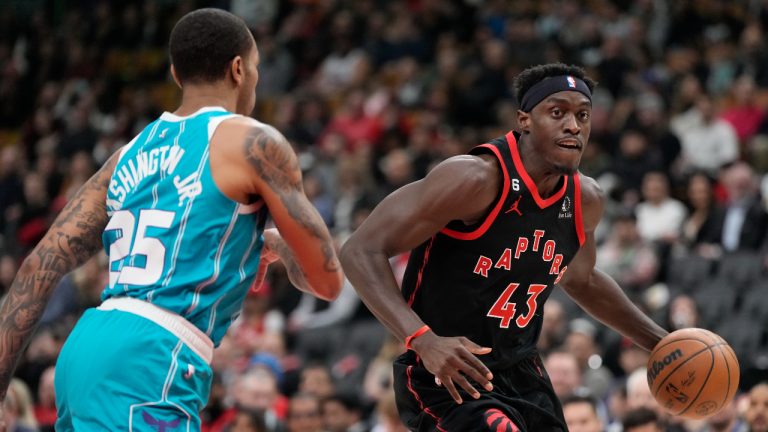 Toronto Raptors forward Pascal Siakam (43) controls the ball as Charlotte Hornets forward P.J. Washington (25) defends during first half NBA basketball action. (Frank Gunn/CP)