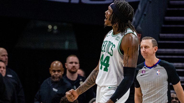 Boston Celtics center Robert Williams III (44) celebrates after drawing the foul against the Charlotte Hornets during the first half of an NBA basketball game on Saturday, Jan. 14, 2023, in Charlotte, N.C. (Scott Kinser/AP)