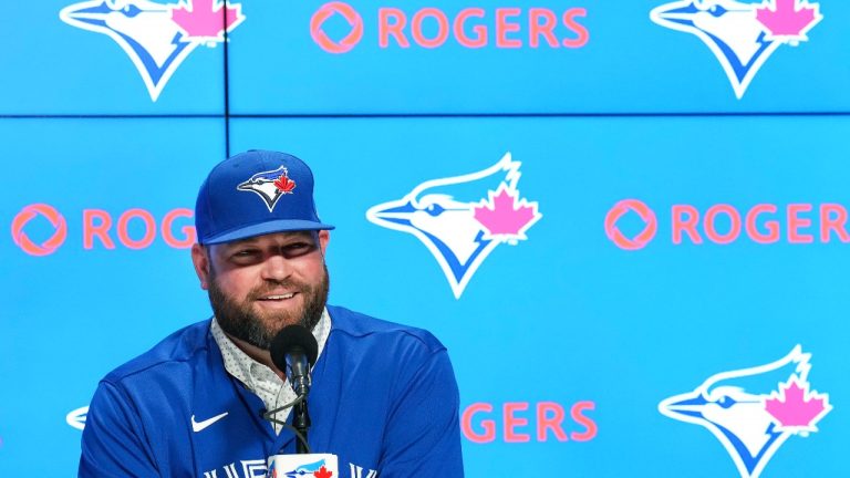 Toronto Blue Jays manager John Schneider smiles after being announced a three-year contract to remain as the team's manager during a press conference in Toronto on Friday, Oct. 21, 2022. (Nathan Denette/The Canadian Press)