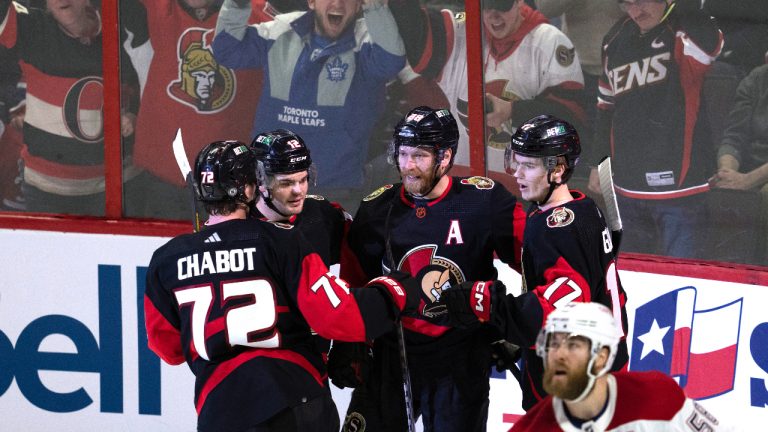 Fans cheer as Ottawa Senators right wing Claude Giroux celebrates his second goal of the period with teammates defenseman Thomas Chabot (left), right wing Alex DeBrincat and centre Ridly Greig during second period action against the Montreal Canadiens NHL action, Saturday, January 28, 2023 in Ottawa. (CP)