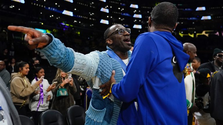 Former NFL player Shannon Sharpe, left, talks with Tee Morant, father of Memphis Grizzlies guard Ja Morant, after an NBA basketball game against the Los Angeles Lakers in Los Angeles, Friday, Jan. 20, 2023. At halftime, Sharpe confronted Memphis Grizzlies forward Dillon Brooks and center Steven Adams. (Ashley Landis/AP)