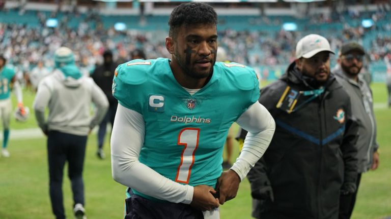 Miami Dolphins quarterback Tua Tagovailoa walks off the field after an NFL football game against the Green Bay Packers, Sunday, Dec. 25, 2022, in Miami Gardens, Fla. (Jim Rassol/AP Photo)