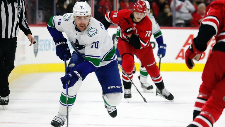 Vancouver Canucks' Tanner Pearson (70) brings the puck up the ice against the Carolina Hurricanes during the first period of an NHL hockey game in Raleigh, N.C., Saturday, Jan. 15, 2022. (Karl B DeBlaker/AP)