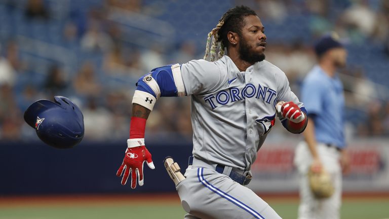 Toronto Blue Jays' Raimel Tapia loses his helmet running to first against the Tampa Bay Rays during the third inning of a baseball game Sunday, Sept. 25, 2022, in St. Petersburg, Fla. (Scott Audette/AP)