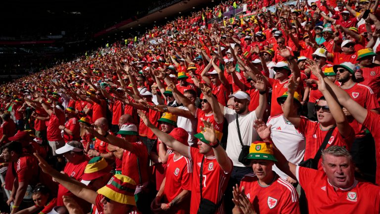 Wales supporters cheer for their team prior to the start of the World Cup group B soccer match between Wales and Iran, at the Ahmad Bin Ali Stadium in Al Rayyan, Qatar, Friday, Nov. 25, 2022. (Alessandra Tarantino/AP)