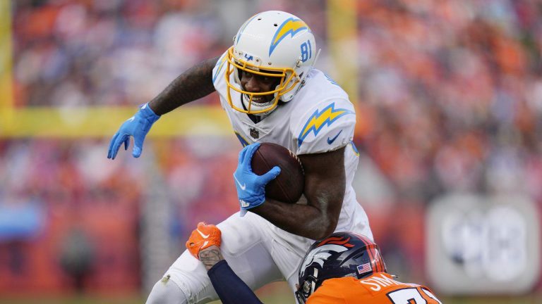 Los Angeles Chargers wide receiver Mike Williams (81) is hit by Denver Broncos safety Justin Simmons (31) after making a catch during the first half of an NFL football game in Denver, Sunday, Jan. 8, 2023. (Jack Dempsey/AP)