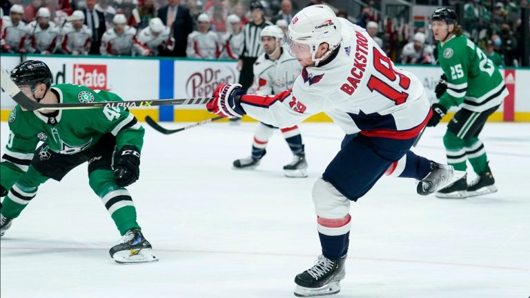 Washington Capitals center Nicklas Backstrom (19) follows through on his goal as Dallas Stars' Jacob Peterson (40) skates past in the second period of an NHL hockey game in Dallas, Friday, Jan. 28, 2022. (Tony Gutierrez/AP)