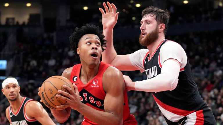 Toronto Raptors forward Scottie Barnes (4) goes to the net against Portland Trail Blazers centre Jusuf Nurkic (27) during second half NBA basketball action in Toronto on Sunday, Jan. 8, 2023. (Frank Gunn/CP)