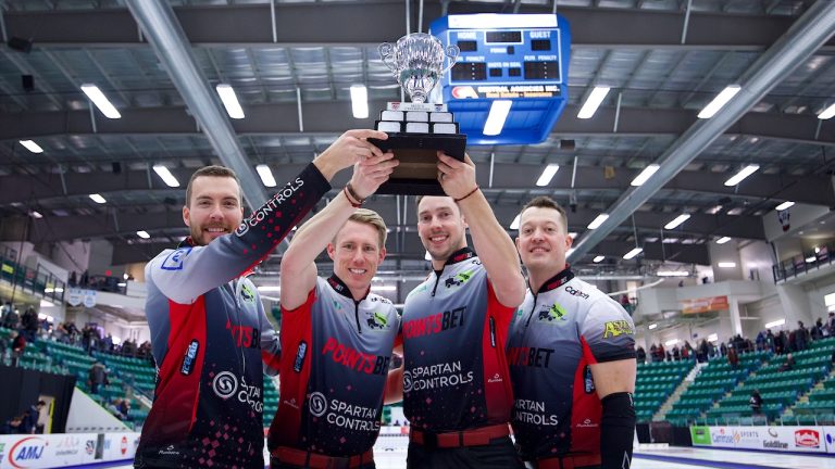 Skip Brendan Bottcher, third Marc Kennedy, second Brett Gallant and lead Ben Hebert pose with the Co-op Canadian Open men's trophy on Sunday, Jan. 15, 2023, in Camrose, Alta. (Anil Mungal/GSOC)