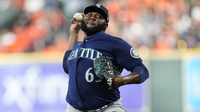 FILE -Seattle Mariners relief pitcher Diego Castillo (63) delivers a pitch against the Houston Astros during the seventh inning in Game 1 of an American League Division Series baseball game in Houston, Tuesday, Oct. 11, 2022. Reliever Diego Castillo and the Seattle Mariners went to salary arbitration Tuesday, Jan. 31, 2023 with the pitcher asking for $3,225,000 and the team offering $2.95 million.(Kevin M. Cox/AP)