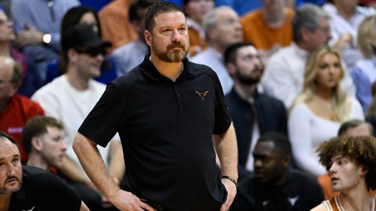 Texas head coach Chris Beard watches his team play against Kansas during the first half of an NCAA college basketball game in Lawrence, Kan., Saturday, March 5, 2022. (Reed Hoffmann/AP)