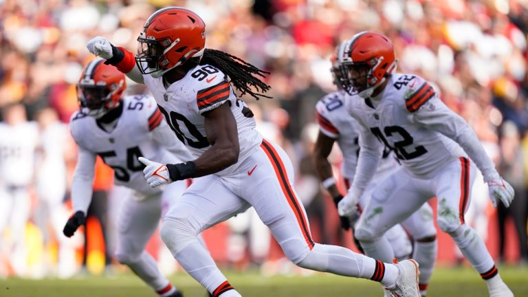 Cleveland Browns defensive end Jadeveon Clowney (90) rushes Washington Commanders quarterback Carson Wentz (11) during the first half of an NFL football game, Sunday, Jan. 1, 2023, in Landover, Md. (Patrick Semansky/AP)