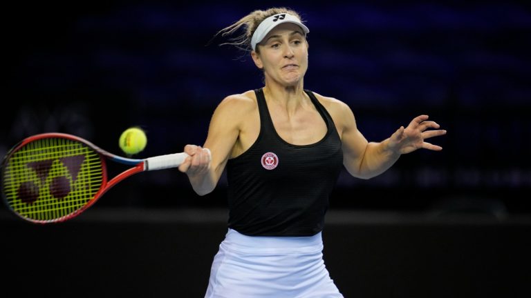 Canada's Gabriela Dabrowski plays as return during a doubles match with playing partner Canada's Leylah Fernandez against Switzerland's Simona Waltert and Jil Teichmann on the 4th day of the Billie Jean King Cup tennis finals at the Emirates Arena in Glasgow, Scotland Friday, Nov. 11, 2022. (Kin Cheung/AP)