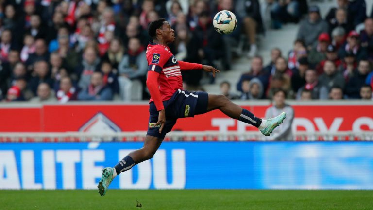 Lille's Jonathan David, of Canada, controls the ball in the air during the French League One match Lille against Angers at the Pierre Mauroy stadium Sunday, Nov. 13, 2022 in Lille, northern France. (Michel Spingler/AP) 