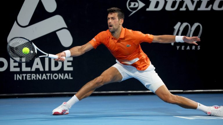 Serbia's Novak Djokovic makes a forehand return to Russia's Daniil Medvedev in the semi final match at the Adelaide International Tennis tournament in Adelaide, Australia, Saturday, Jan. 7, 2023. (Kelly Barnes/AP)