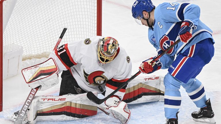 Ottawa Senators goaltender Anton Forsberg (31) stops Montreal Canadiens' Nick Suzuki during first period NHL hockey action in Montreal, Tuesday, January 31, 2023. (Graham Hughes/CP)