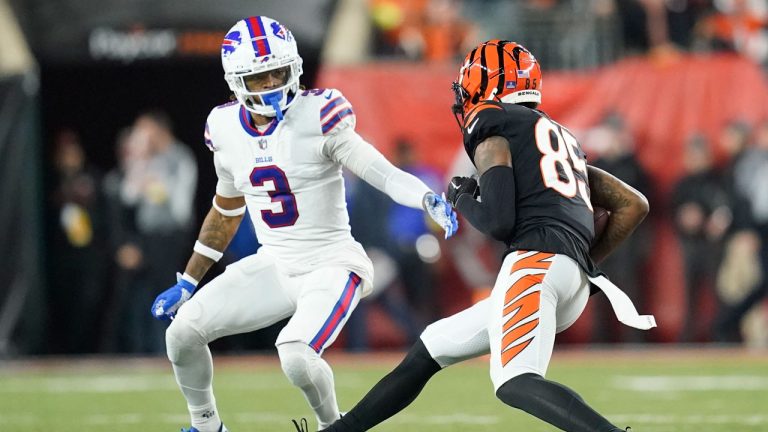 Cincinnati Bengals wide receiver Tee Higgins (85) runs near Buffalo Bills safety Damar Hamlin (3) during the first half of an NFL football game. (Joshua A. Bickel/AP)