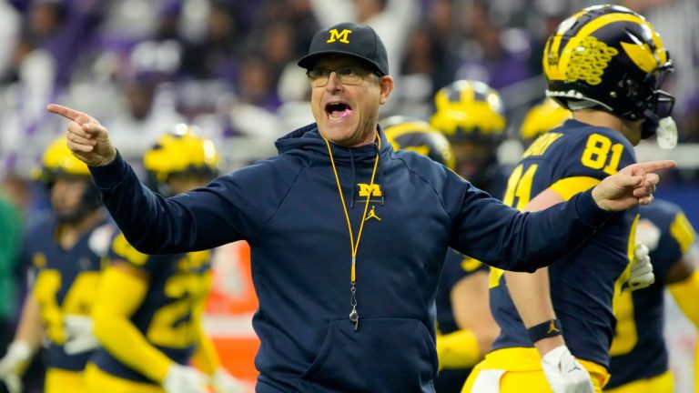 Michigan head coach Jim Harbaugh watches his players prior to the Fiesta Bowl NCAA college football semifinal playoff game against TCU, Saturday, Dec. 31, 2022, in Glendale, Ariz. (Rick Scuteri/AP)