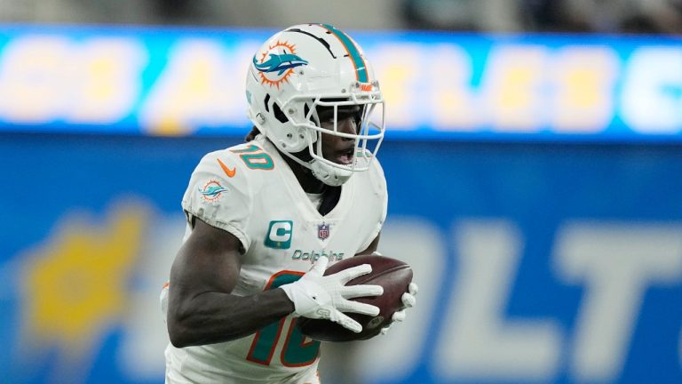 Miami Dolphins wide receiver Tyreek Hill catches a touchdown during the second half of an NFL football game against the Los Angeles Chargers Sunday, Dec. 11, 2022, in Inglewood, Calif. (Mark J. Terrill/AP)