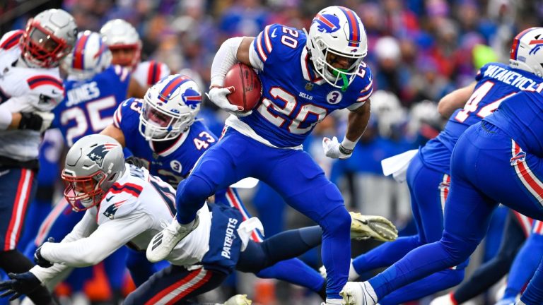 Buffalo Bills running back Nyheim Hines (20) runs in a touchdown on a kickoff return during the first half of an NFL football game against the New England Patriots, Sunday, Jan. 8, 2023, in Orchard Park. (Adrian Kraus/AP)