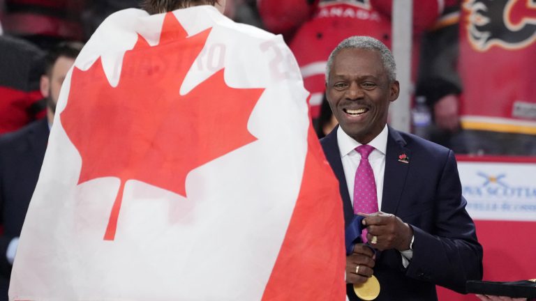 Hugh Fraser, Hockey Canada Board Chair, prepares the gold medals during the medal ceremony of the IIHF World Junior Hockey Championship gold medal game in Halifax. (Darren Calabrese/CP)