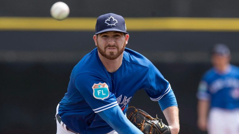 Toronto Blue Jays pitcher Drew Hutchison throws his warmup pitches during first inning spring training action against the Philadelphia Phillies in Dunedin, FLa., on Saturday, March 5, 2016. (Frank Gunn/The Canadian Press)